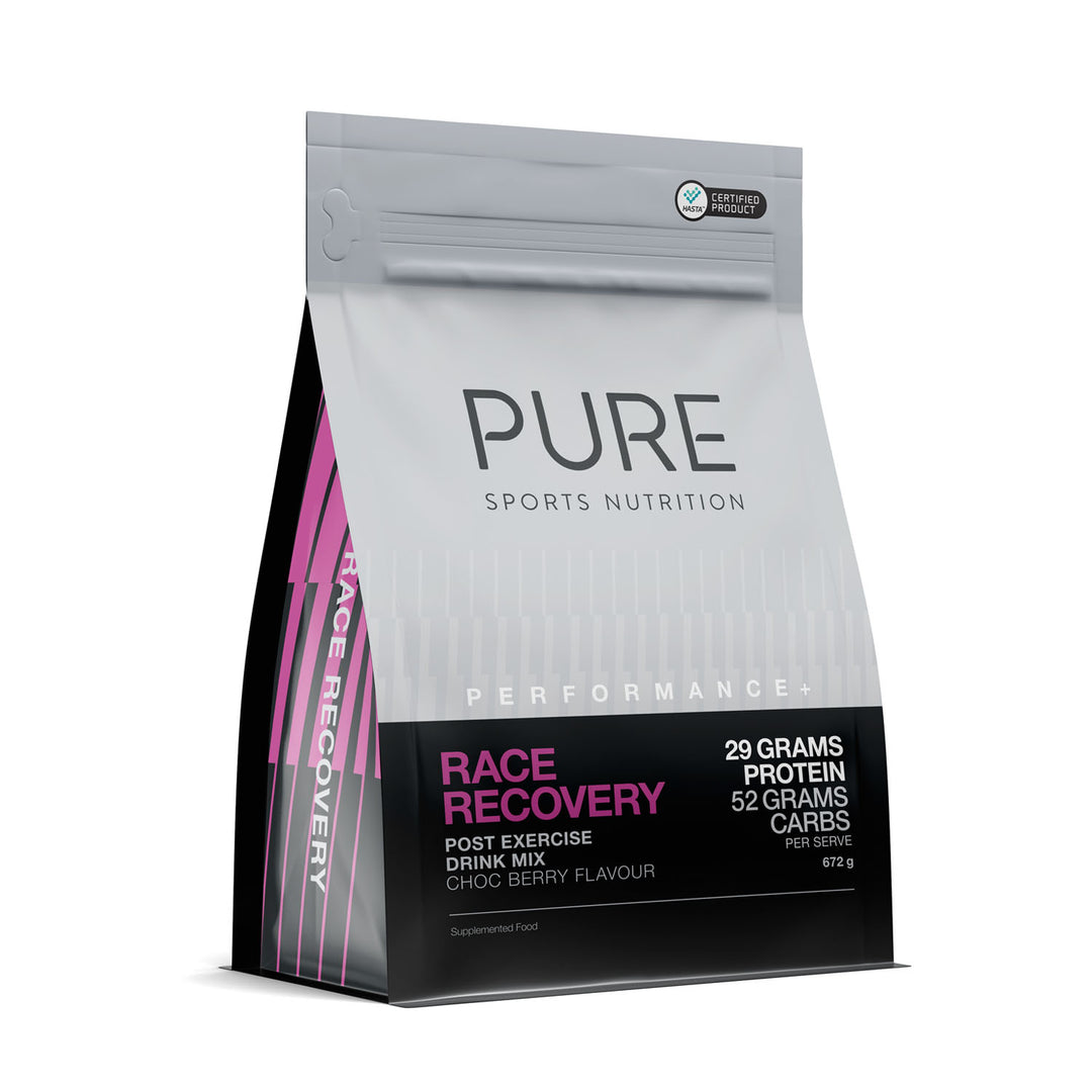 A package of PURE Sports Nutrition Race Recovery drink mix with the label showing the product name and its features, such as 29g protein, 62g carbs, and 4g sodium.